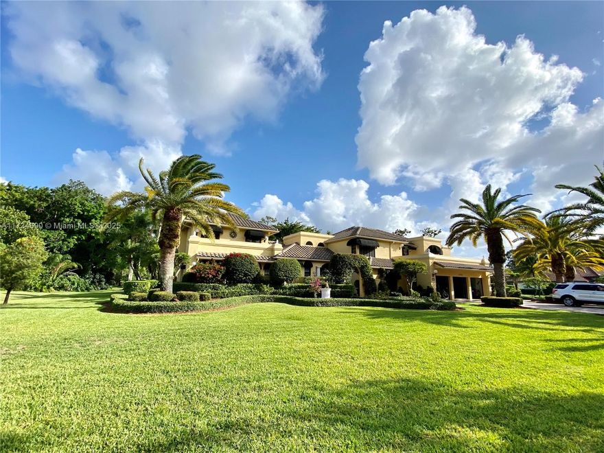 Breathtaking Mediterranean Style Mansion in Whispering Woods, 1 acre Cul De Sac Homesite. 7479 sqf living area. Magnificent gardens, stile resort pool with heater, gazebo and catio. Professionally decorated 2 stories, 7 bedrooms with walking closets and designed cabinets, 7 complete bath and 1 half bath, living room, dinning room, 2 family room, fire place, 2 offices spaces, laundry area,  and extra space room used as playroom but can be used as Gym or cinema room, exceptional kitchen  with huge eat in area, granite counters, SS Viking appliances ,Stove, double ovens, large center cooking island. Also Wiener room, Huge Garage with cabinets and space for 3 vehicles plus parking area. Marbel, wood fand laminated floors. The roof is just 10 years old, impact windows,  new A/C, water heather.