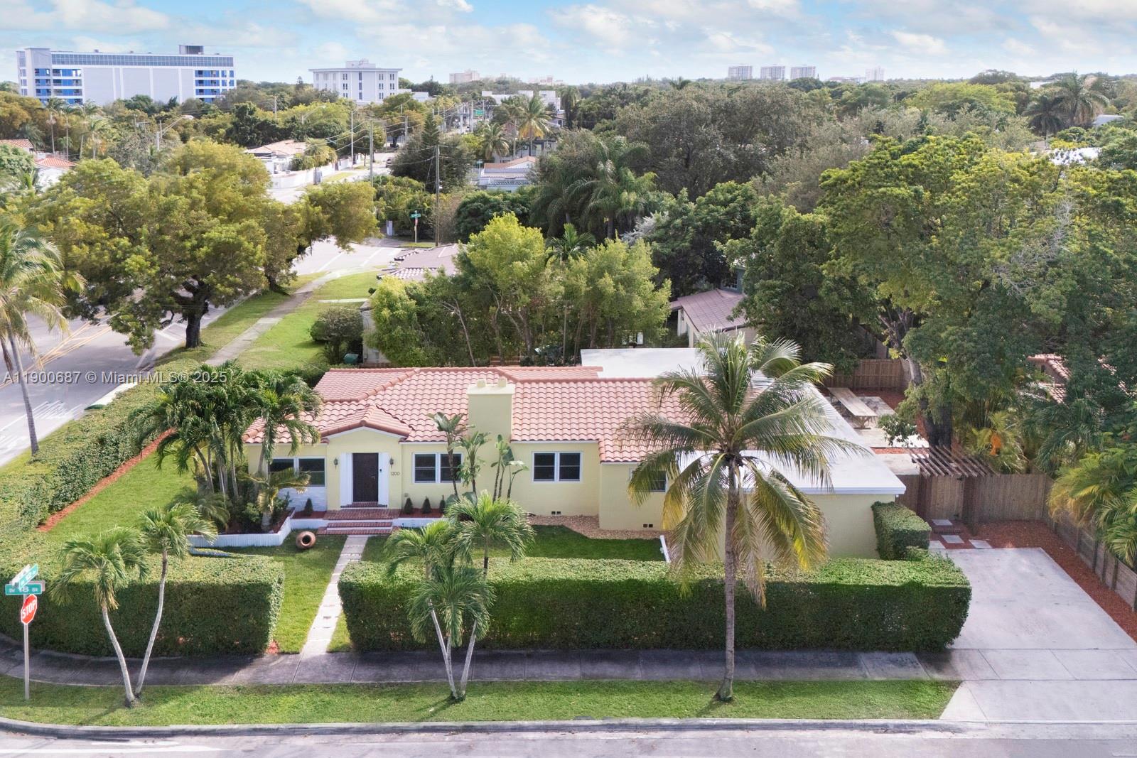 This spacious residence offers over 2,750 sqft & blends timeless charm with modern upgrades. Sitting on a nearly 10,000 sqft corner lot, the home features 3 beds plus a den/office, a completely renovated master wing with expansive custom closets & a luxurious steam shower Original details like the fireplace & wood floors preserve its character. Major improvements include trenchless plumbing sleeving, Impact windows & doors, new AC ducts, new appliances, & roof improvements in 2019. The property is surrounded by mature hedges offering both privacy & security. Located in The Roads neighborhood, just steps from Brickell & minutes from Coconut Grove & Coral Gables. Restaurants & shops along Coral Way & in Little Havana are easily accessible via the beautiful linear walking park along 13th Ave.