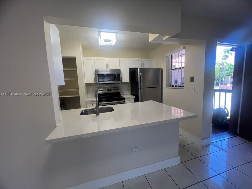 Remodeled 3/2 in Lago Grande Condominium. Gated community with security at gate. Unit located on the 2nd floor. Kitchen features white cabinets, quartz counter tops, stainless steel appliances. Plenty of storage space. PVC floors in bedrooms, tile floors in the rest of the property. Remodeled bathrooms. Washer and dryer in unit. Balcony. Small pets allowed. Tenant pays for all utilities. Small pets allowed with landlord's approval. 1 assigned parking space + guest parking. MOVE IN WITH 1ST MONTH & 1 MONTH SECURITY DEPOSIT FOR QUALIFIED APPLICANTS. Tenant occupied until 11/15.