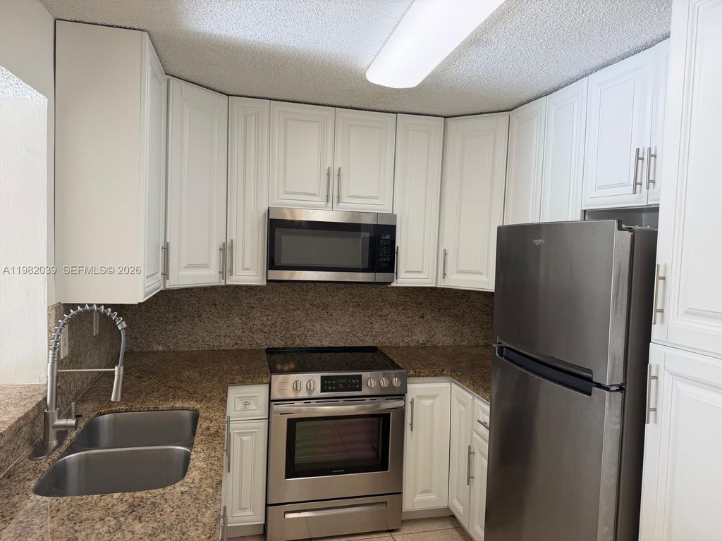 Photo of 200 W Palm Cir W #107, Pembroke Pines, FL 33025 (MLS # A11982039)