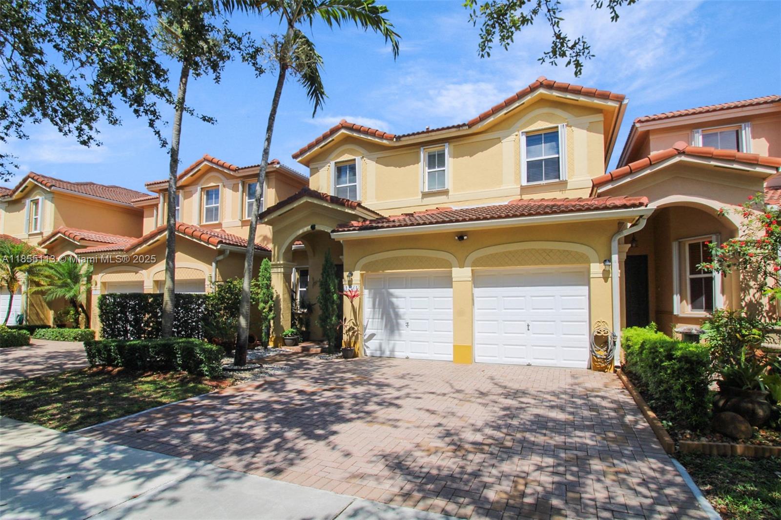 Step into this immaculate move-in-ready 3-bed, 2.5-bath home, offering 1,843 sq ft of bright, open living space. The modern, open-concept kitchen boasts stainless steel appliances and a wine cooler, perfect for entertaining. Enjoy high ceilings, imported tile floors, and hurricane-ready accordion shutters. Upstairs, find a spacious primary suite with a spa-style bath and walk-in closet, plus two additional bedrooms with a Jack & Jill bath. Benefit from a convenient 2-car garage and a beautiful French pattern travertine patio—access resort-style amenities: 3 pools, fitness center, play area, and security patrol. Ideally located minutes from schools, dining, Turnpike, and 874 Don Shula Expy.