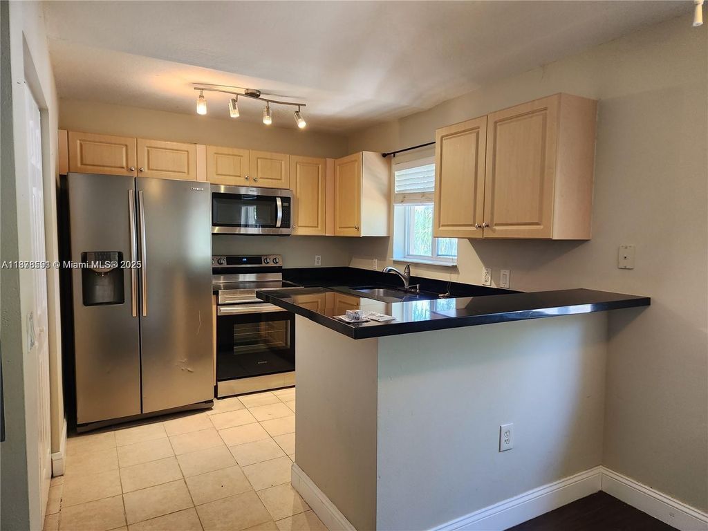 Photo of 3810 N Jog Rd #201, West Palm Beach, FL 33411 (MLS # A11878591)