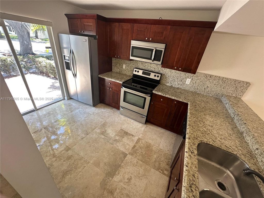 Photo of 878 Crystal Lake Dr, Deerfield Beach, FL 33064 (MLS # A11796565)