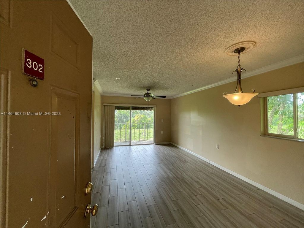 Photo of 1191 N Benoist Farms Rd #302, West Palm Beach, FL 33411 (MLS # A11464808)