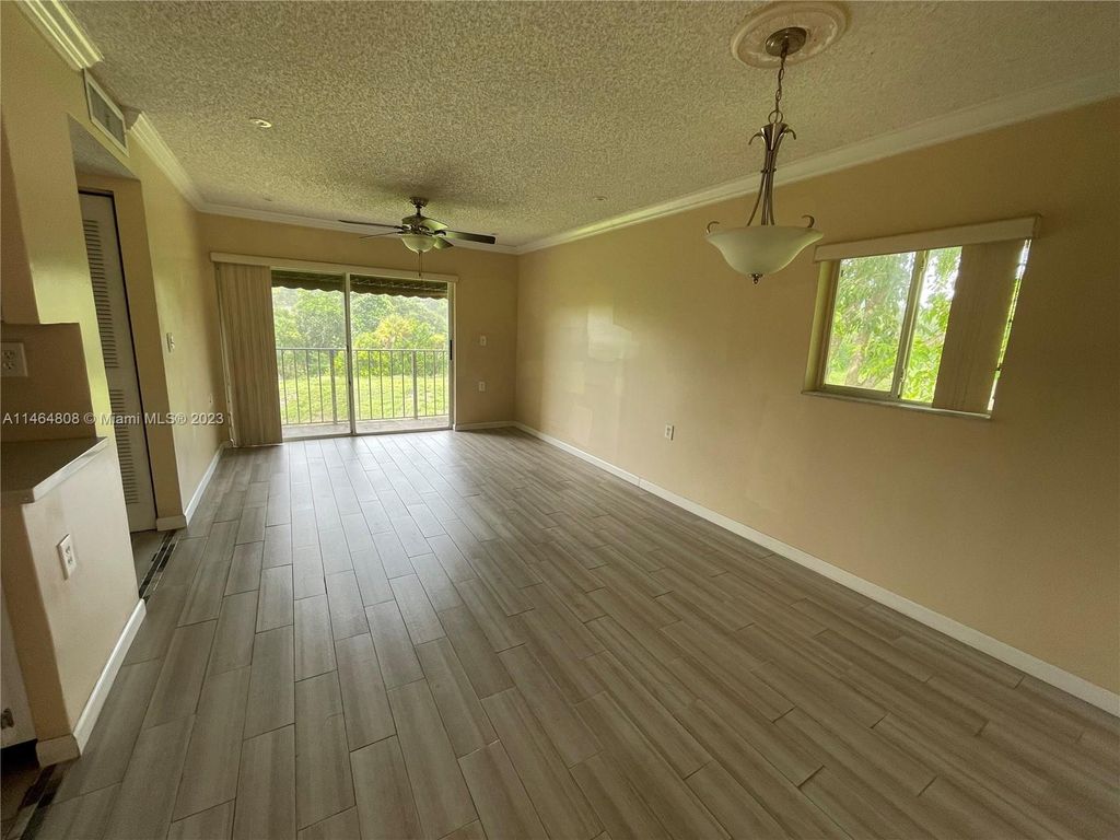 Photo of 1191 N Benoist Farms Rd #302, West Palm Beach, FL 33411 (MLS # A11464808)