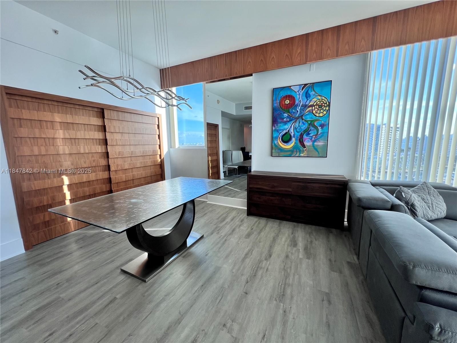 AS-IS CORNER UNIT with amazing and unobstructed views, unit has 2 beds 2 bath and 2 covered parking spots in a gated garage. Modern design kitchen with central cooktop. Impact windows from the floor to the ceiling. Breath taking sunrise or sunset views. Plenty of Amenities including 24/7 security, tennis and half basketball courts, gym, large pool, jacuzzi, marina, bicycle and kayak storage. Unique location and priceless water view features to mention few in this AS-IS unit for sale. Seller may pay in full special assessment at closing depending on the offer price. Unit ready to move in, it can be furnished or not.