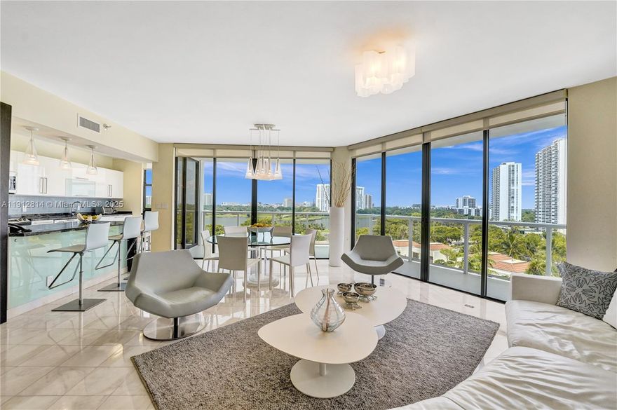 This beautifully furnished bright unit offers 3 BD + den/office/guest room & 3 full bath. It boasts a modern look, tastefully decorated & renovated. Marble floors in living areas & bamboo floors in bedrooms. Access to balcony from all rooms to enjoy beautiful views of the pool, lake, golf course & Aventura skyline. An open-layout floor plan that joins multiple spaces promoting an airy ambiance. Open kitchen, white glossy cabinets, SS appliances, granite countertops & tiled backsplash. Ample closet space. Luxury living in The Hamptons; two pools, a private gourmet restaurant, Wi-Fi café, Movie Theater, state-of-the-art fitness center & spa, tennis & racquetball courts, party room & Kids playroom. Enjoy strolls in “the circle”. Available for annual & seasonal rent, offered only furnished.