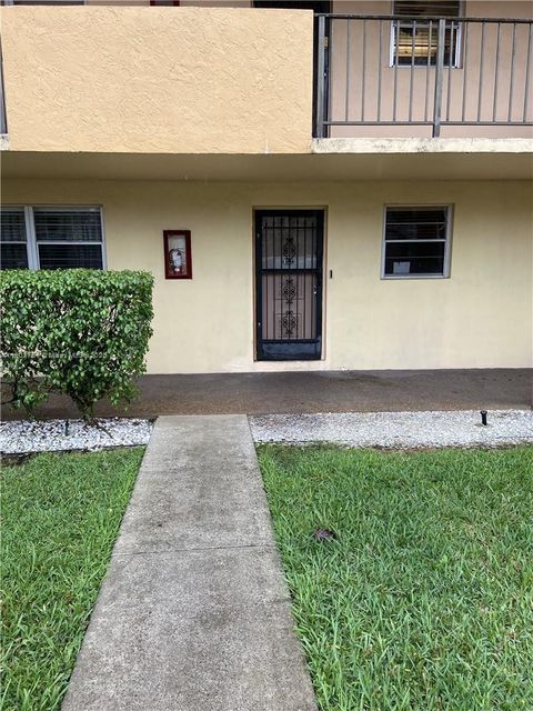 Photo of 3955 N Nob Hill Rd #101, Sunrise, FL 33351 (MLS # A11902751)