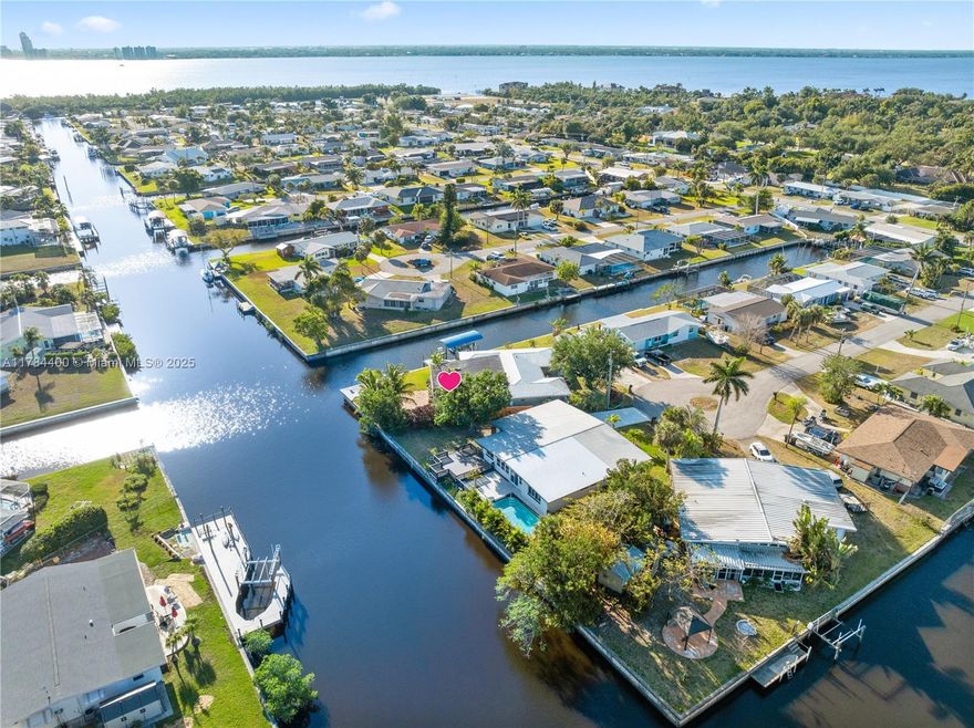 Priced to Sell! Stunning waterfront home on an intersecting canal with breathtaking views and direct sailboat access to the Gulf. Features 200 ft of seawall with riprap, composite dock, and 8,000 lb boat lift. Move-in ready with open-concept layout, high-end finishes, chef’s kitchen with oversized island, and spacious screened terrace overlooking the water. Master and guest bedrooms open to the patio and canal. Upgrades include impact windows/doors, plantation shutters, new plumbing, metal roof, tankless gas water heater, new washer/dryer, remodeled garage, and more. Ample parking space for RVs, trailers, and multiple vehicles. No HOA and No storm flooding or water intrusion. Ideal for primary, vacation, or short-term rental. Boat available for purchase. Easy to Show!