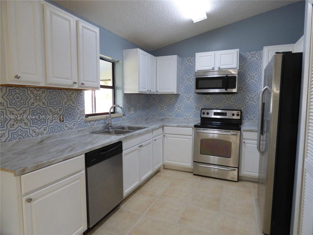 Photo of 5629 NW Commodore Ter, Port Saint Lucie, FL 34983 (MLS # A11539154)