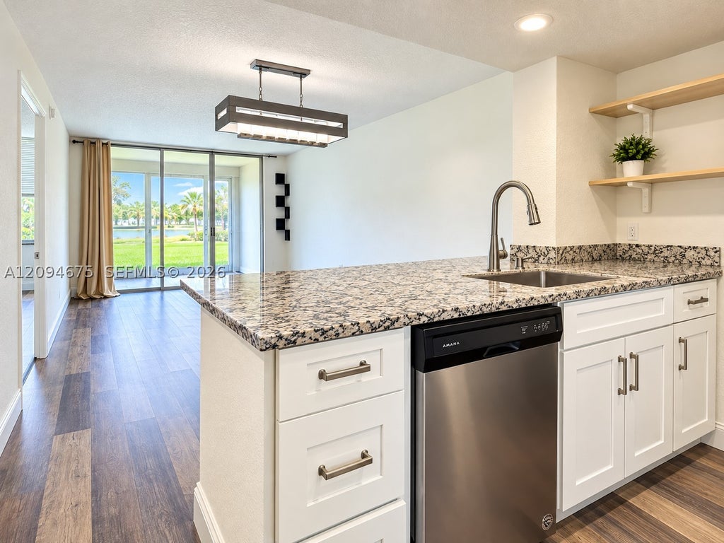 Photo of 9440 Poinciana Pl #106, Davie, FL 33324 (MLS # A12094675)