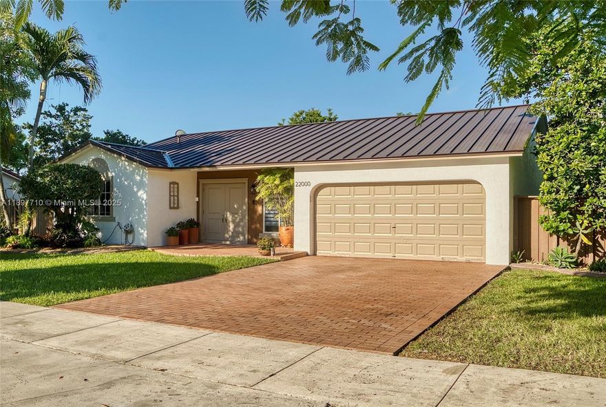 Impeccable and beautifully maintained! This completely remodeled and modernized residence offers 3 bedrooms/2 bathrooms with a two car garage on a 12,500 sf lot that features an impressive fruit tree inventory. New metal roof 2022, new A/C 2021, freshly painted in and out, same consistent ceramic tile throughout (even in the garage), custom closets, upgraded doors/moldings & hardware, new W&D, composite fence, custom built storage shed, termite tented Sept 2025, and so much more! Truly a turn-key perfect home, no detail left unattended. If you like outdoor living/entertainment, this is your dream home with a beautiful composite wood deck overlooking a collection of over 20 exotic fruit trees, flowering plants and orchids. Schedule a private tour today before it's too late!!