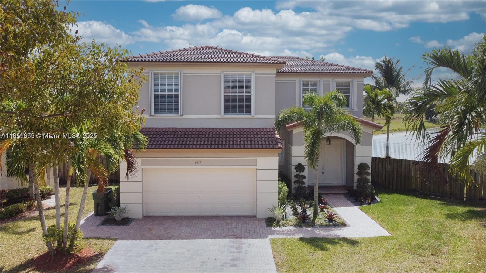 Gorgeous Single family lakefront corner home in Waterstone Floridian Isles Estates. Home features 4 bedrooms 3 baths. No expenses spared when renovating this beauty. You will love entertaining on this huge property w/ mature coconut trees and gorgeous lakeview. Brand new laminate wood floors throughout, custom kitchen w/ brand new stainless steel appliances, white wood cabinets, quartz counters & island for perfect for families. Bedrooms are upstairs with an oversized upgraded 4th bedroom, considered a 2nd master, all with California custom closets. Two car garage w cabinets for additional storage. Accordian shutters and sprinkler system w/well water. Conveniently near Airforce Base perfect for military families. Close to hospital, Homestead Speed Way, restaurants and shopping centers.