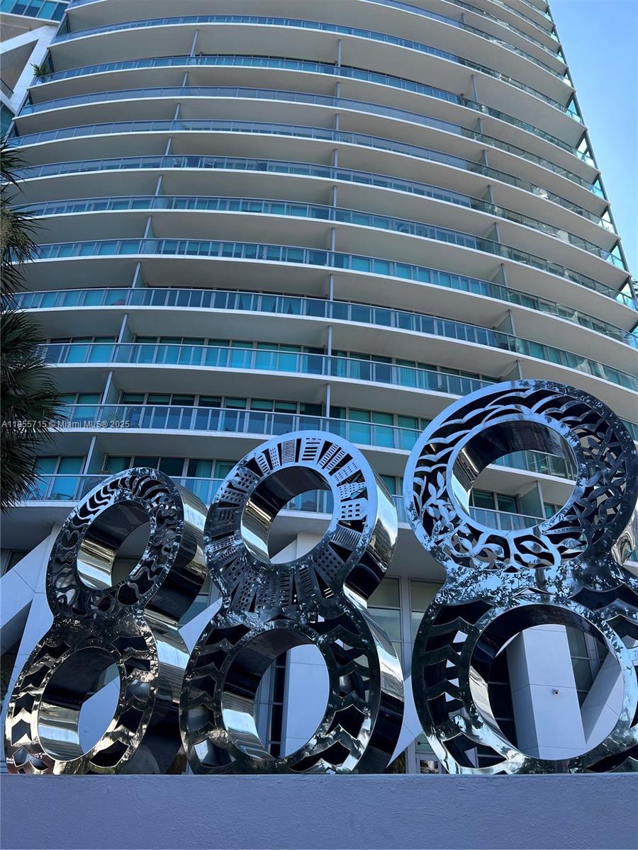 Live above it all in this stunning 1BR/1.5BA on the 41st floor at Marina Blue with panoramic bay and ocean views. Spacious layout with floor-to-ceiling impact glass, modern kitchen with granite countertops and stainless steel appliances. Primary suite features a walk-in closet and spa-style bath. Enjoy morning sunrises from your oversized private balcony. New A/C unit installed 6 months ago. Full-service luxury building with 2 pools, fitness center, yoga room, 24/7 concierge, and more. Prime location across from Kaseya Center and steps to Bayside, museums, and Metromover. One assigned parking space. Exceptional value at $630K—won’t last!