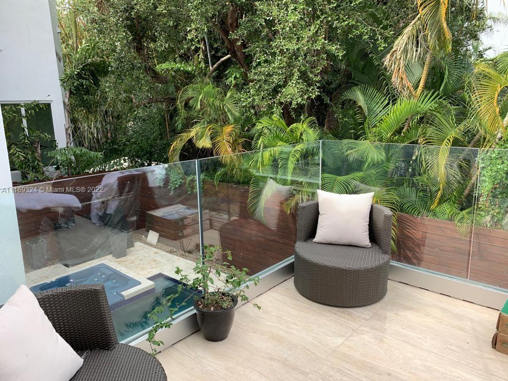 In the Heart of Coconut Grove sits this private, secluded & secured beautifully manicured home. Easy access to US1. Minutes from Downtown, Cocowalk, charming boutiques, galleries, restaurants, sidewalk cafes, the bay & parks. The house features 4 bedrooms, 3 bathrooms & powder room. There is a garage fully equipped with washer & dryer. The large open kitchen is spacious enough for gatherings & entertaining. Living room large flat screen TV cable ready. Sonos stereo system, security cameras throughout house & patio. Backyard is an oasis with design pool, hot tub.