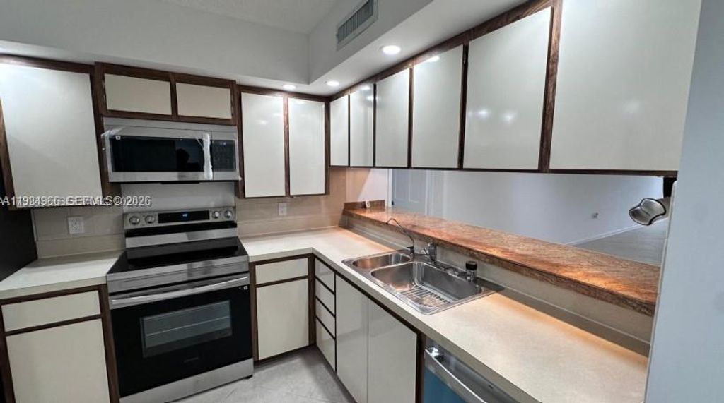 Photo of 1703 Whitehall Dr #104, Davie, FL 33324 (MLS # A11984966)