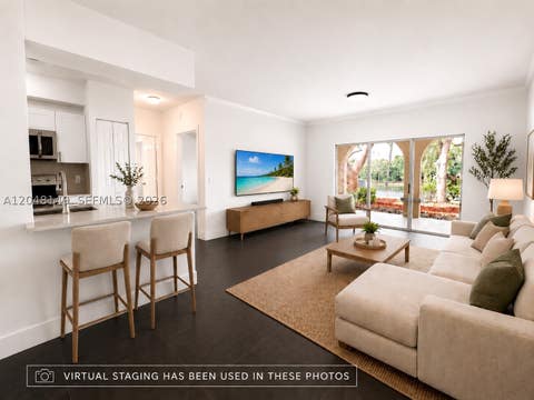 Photo of 2452 Centergate Dr #102, Miramar, FL 33025 (MLS # A12048149)