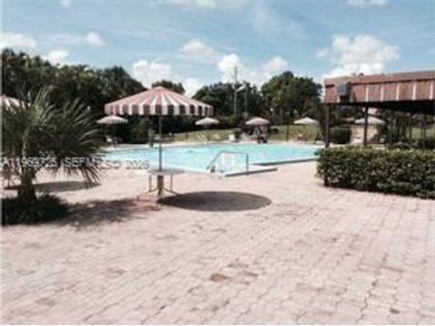 Photo of 7300 NW 17th St #411, Plantation, FL 33313 (MLS # A11969725)