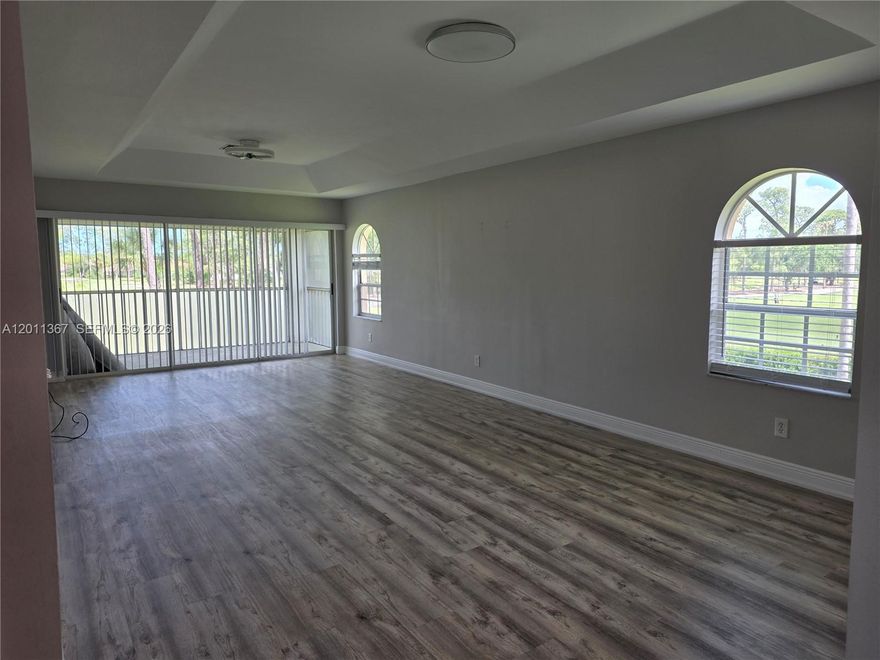 Bright, airy corner residence with expansive water and golf-course views in the heart of Lely’s established golf corridor. This end unit offers exceptional natural light, extra windows, and a peaceful setting overlooking the lake and fairways—an ideal backdrop for morning coffee or sunset breezes. The split-bedroom layout provides privacy for guests or a dedicated home office. The primary suite enjoys tranquil views, generous closet space, and an ensuite bath. Additional conveniences include in-unit laundry, covered parking, and extra storage.  Near Pickle Ball Center and downtown Naples restaurants