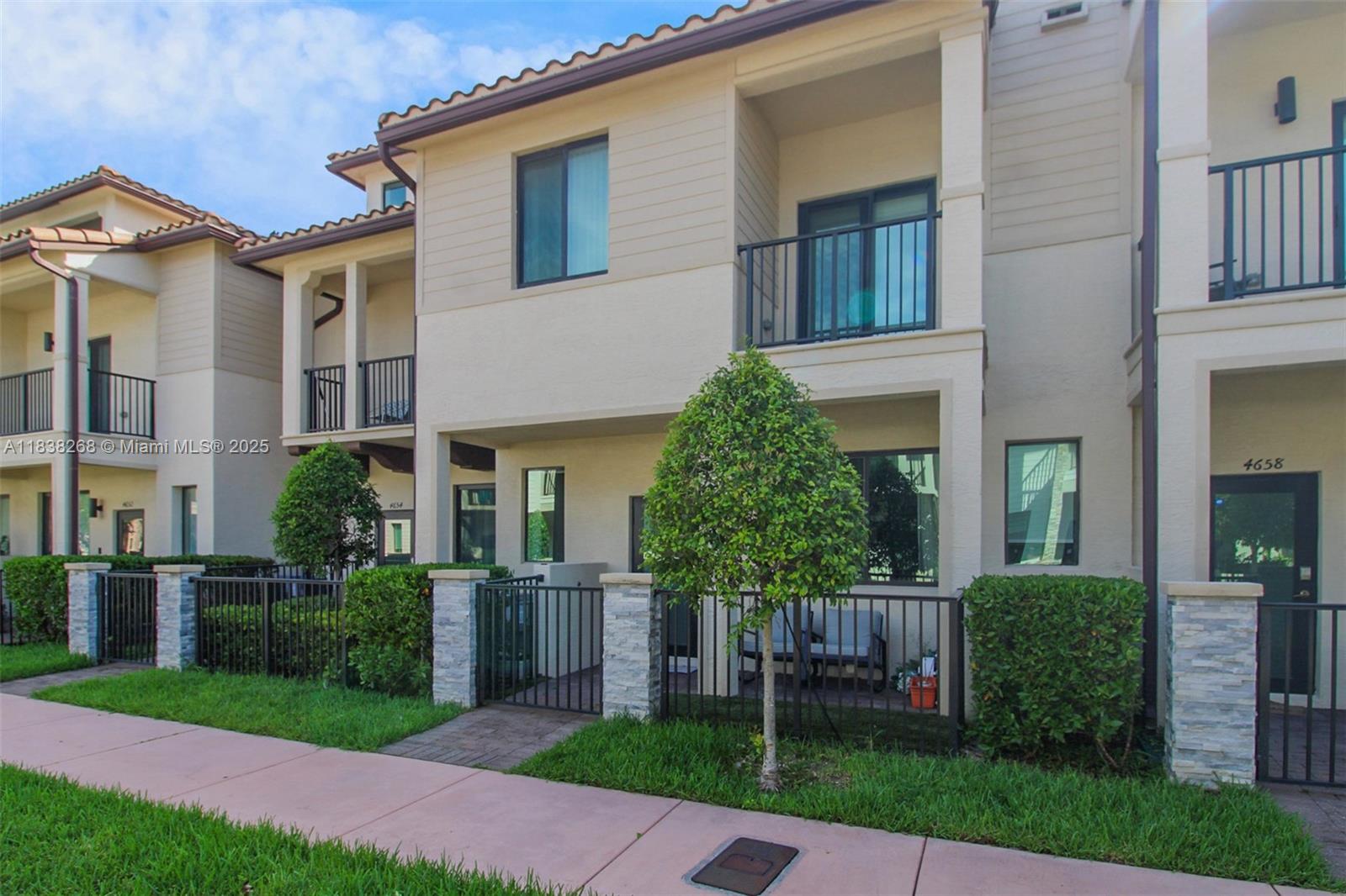 Stunning townhome located in the sought-after community of Urbana at Downtown Doral. This spacious and modern residence features an open-concept layout with elegant floors, custom made closets and plenty of natural light throughout. The kitchen boasts quartz countertops, stainless steel appliances, a large island, and ample storage. Upstairs, you’ll find generously sized bedrooms including a luxurious primary suite with 2 closets, one of them being a walk-in closet. Enjoy a private two-car garage, smart home technology, and a charming balcony. Living at Urbana means enjoying resort-style amenities including a sparkling pool, fitness center, clubhouse, and children’s play area. Just steps from Downtown Doral’s shops, restaurants, parks, top-rated schools, and major highways.