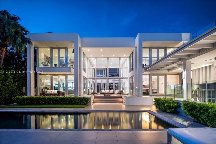 Biscaya Island-Surfside-One of a Kind modern masterpiece. No expense spared! 5 en suite bedrooms + staff quarters. Over 7,600 sf on oversize 15,000 sf lot with spectacular wide bay views. Fabulous pool area, sleek covered terrace with summer kitchen, spacious outdoor dining and bar area + cabana bath. Elegant gated entry, state of the art design with floor to ceiling glass, soaring ceilings & grey limestone & wood floors throughout. Gourmet kitchen & oversize dining room for 14. Fabulous family room with custom built professional bar. Walk to beaches, places of worship & renowned Bal Harbour Shops.