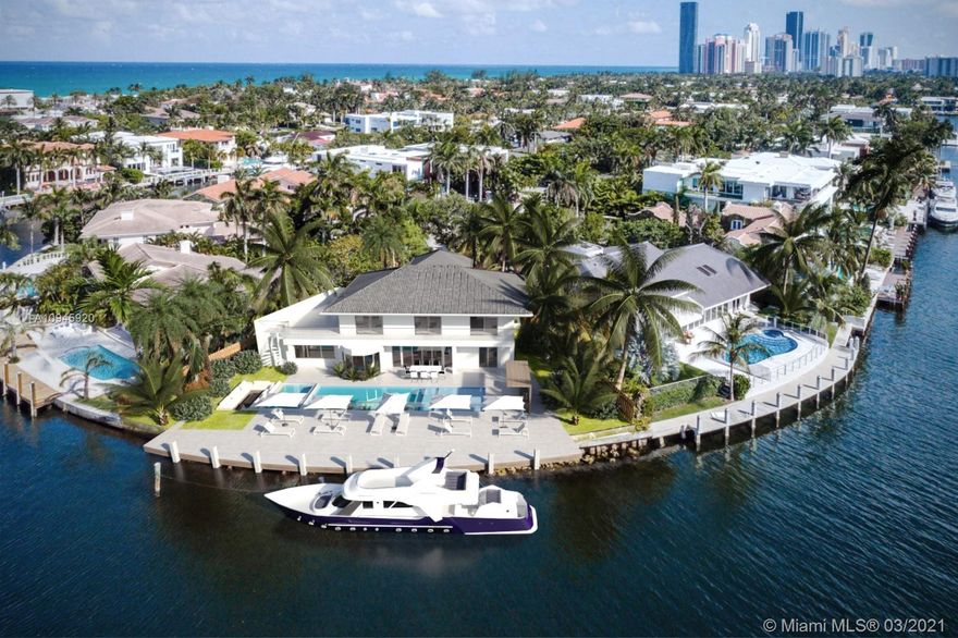One of a Kind Point Lot!  Intracoastal 6 bed/6 bath home with 125' of water frontage at the north point of Center Island in exclusive, gated Golden Beach. Enjoy your own Town police force, tennis courts and beautiful private beach with lifeguard and water activities. Amazing open water views!  Interior renovations paused to sell As-Is now at $4,975,000 with approved plans for new kitchen & 6 new Baths. (see first 5 photos). Has new impact doors and windows.  Buyer may complete renovations to their own taste or use our contractor and plans for a gorgeous remodel. Walk 2 blocks to the private beach & pavilion, or bike over to tennis courts & playground for kids. Shopping minutes away at Aventura Mall and Bal Harbor.  Walk to houses of worship. Just a short drive to airports and South Beach.