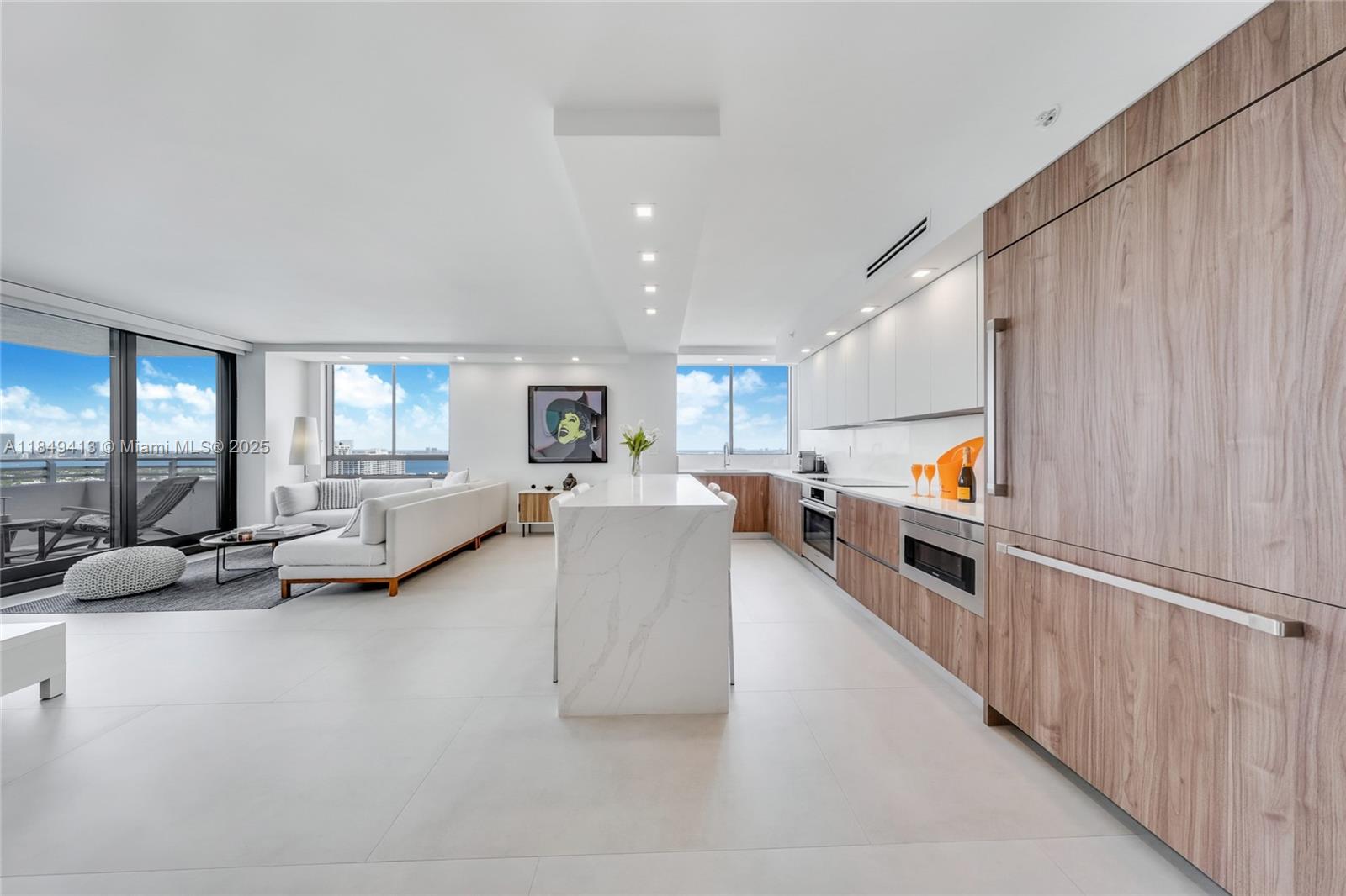 Experience luxury the amenity-rich Waverly. Available as a seasonal rental for six months starting September 1. This completely remodeled split 2-bedroom, 2-bath residence sits on the 25th floor and offers 1,262+sqft with direct bay, city and ocean views. Impeccably furnished and move-in ready, it features porcelain floors, a large private balcony, quartz counters and high-end appliances. Included: high-speed internet, cable, one assigned parking space and valet. Amenities: lagoon-style pool with Star Island and Miami skyline views, tennis court, putting green, gym and a renovated amenity deck with two kitchens and a koi garden. Prime South Beach location close to SoBe attractions. Resort-style building offers 24/7 security, business center and social spaces.