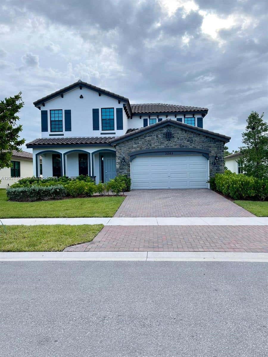 Photo of 3265 Dunning Dr, Royal Palm Beach, FL 33411 (MLS # A12031169)