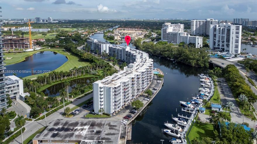 Enjoy stunning water views in this renovated condo. The open-concept layout features porcelain floors, a modern kitchen with granite countertops, backsplash, cooking island, stainless steel appliances, food disposer, smart AC control and security camera. The master suite is designed for comfort, the bathrooms are updated with marble countertops, glass shower doors, and a dual-sink in the master bath. Relax on the screened balcony and enjoy natural light throughout, along with impact windows and doors, plenty of closet space, and extra ground-floor storage. Resort-style amenities include a waterfront pool, fitness center, saunas, game room, laundry facilities on each floor, and a sundeck with barbecue grills. Just one mile from the beach and minutes from shopping, dining, and entertainment.