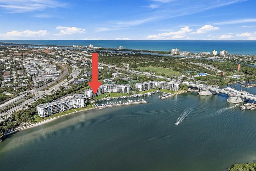 Experience direct Intracoastal views from this meticulously maintained waterfront condo in the highly sought-after Jupiter Cove. This boater's paradise offers an unobstructed blue-water lifestyle, perfect for those seeking a luxurious, maintenance-free condo experience in one of Jupiter's most desirable locations. Step inside this spacious 2-bedroom, 2-bathroom residence boasting 1,500 sq. ft. of living space with an open and airy layout. Natural light floods in through large windows, showcasing breathtaking views of passing yachts and the iconic 1000 North restaurant waterfront scene. The updated gourmet kitchen features modern appliances and a sleek design, making it a chef's dream. Hardwood floors add warmth and elegance throughout the home.
