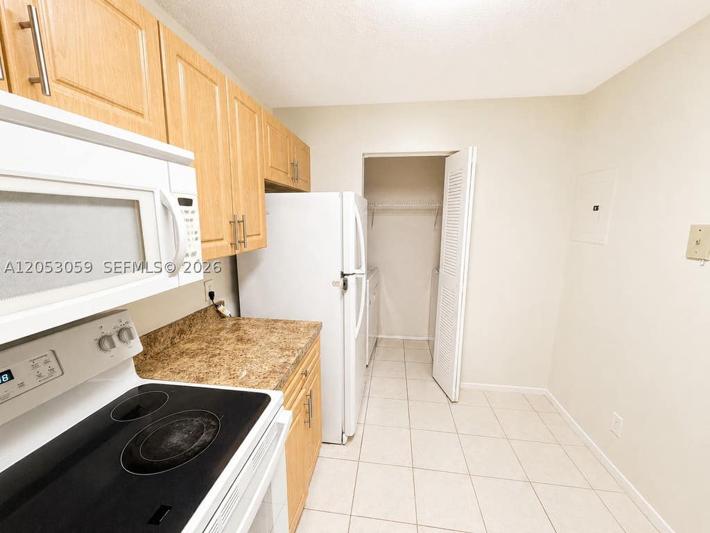 Photo of 11211 W Atlantic Blvd #108, Coral Springs, FL 33071 (MLS # A12053059)