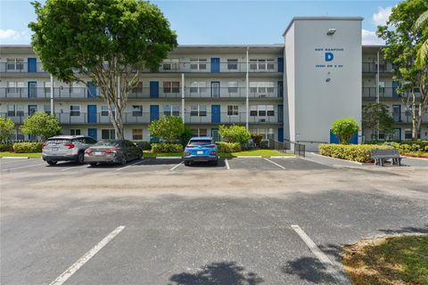 Photo of 13450 SW 3rd St #408D, Pembroke Pines, FL 33027 (MLS # A11827107)