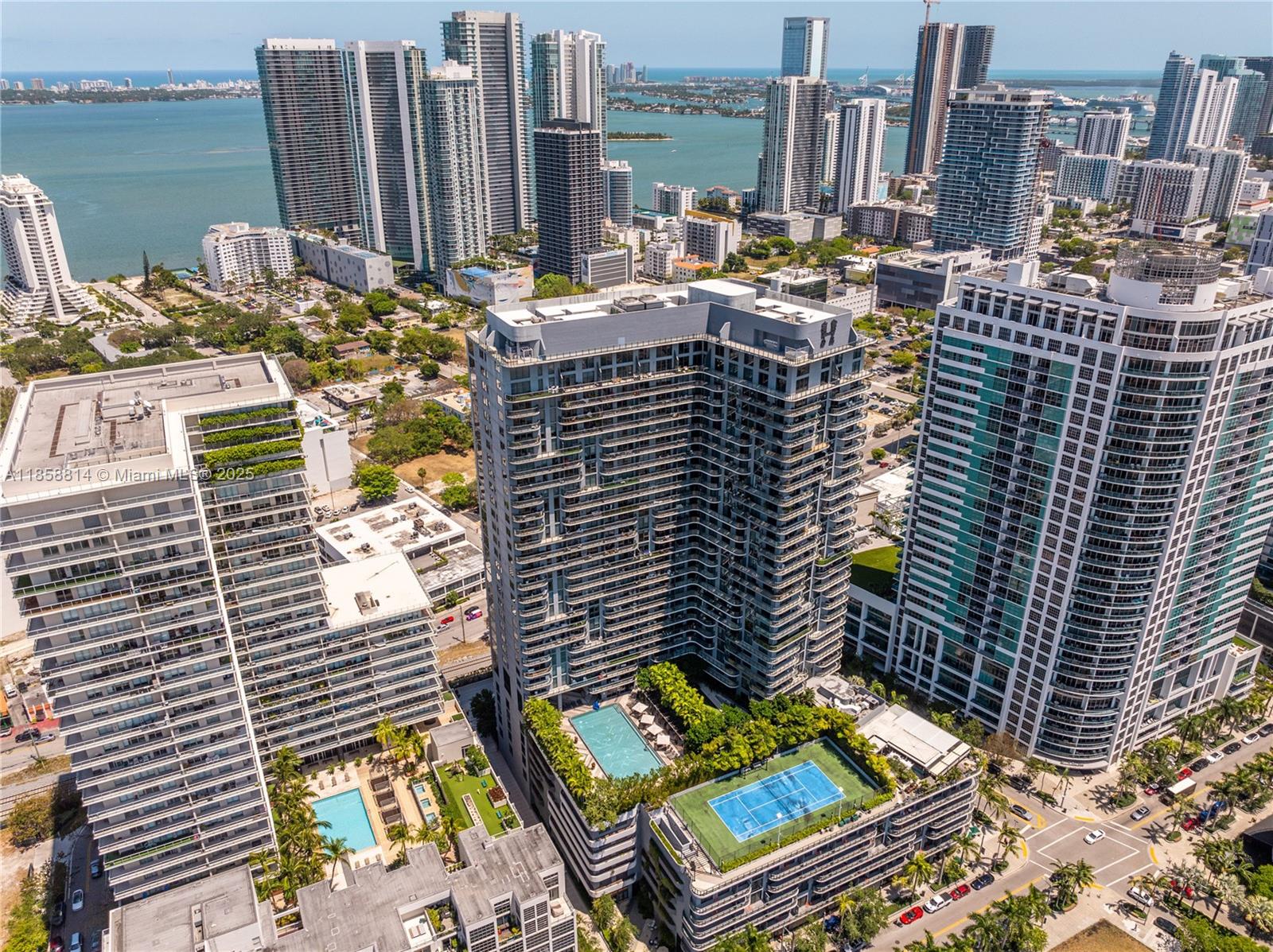Welcome to Residence 1514 at Hyde Midtown! This luxurious 1-bedroom, 1-bath + den “sky home” defines Midtown Miami urban living. Perched on the 15th floor, enjoy stunning views of the pool, tennis courts, lush green spaces and vibrant shopping district from your private balcony. The open-concept design comes complete with a sleek kitchen, premium appliances, spacious living room, plus a versatile “flex den,” great as home office or guest nest. Resort-style amenities: a stunning pool deck, cutting-edge fitness center, tennis courts and an onsite rooftop restaurant. Surrounded by top shops, dining, and the Design District, just 15 minutes to Miami Beach and the airport.