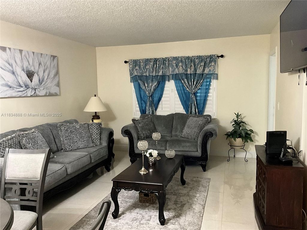 Photo of 300 Berkley Rd #108, Hollywood, FL 33024 (MLS # A11834888)