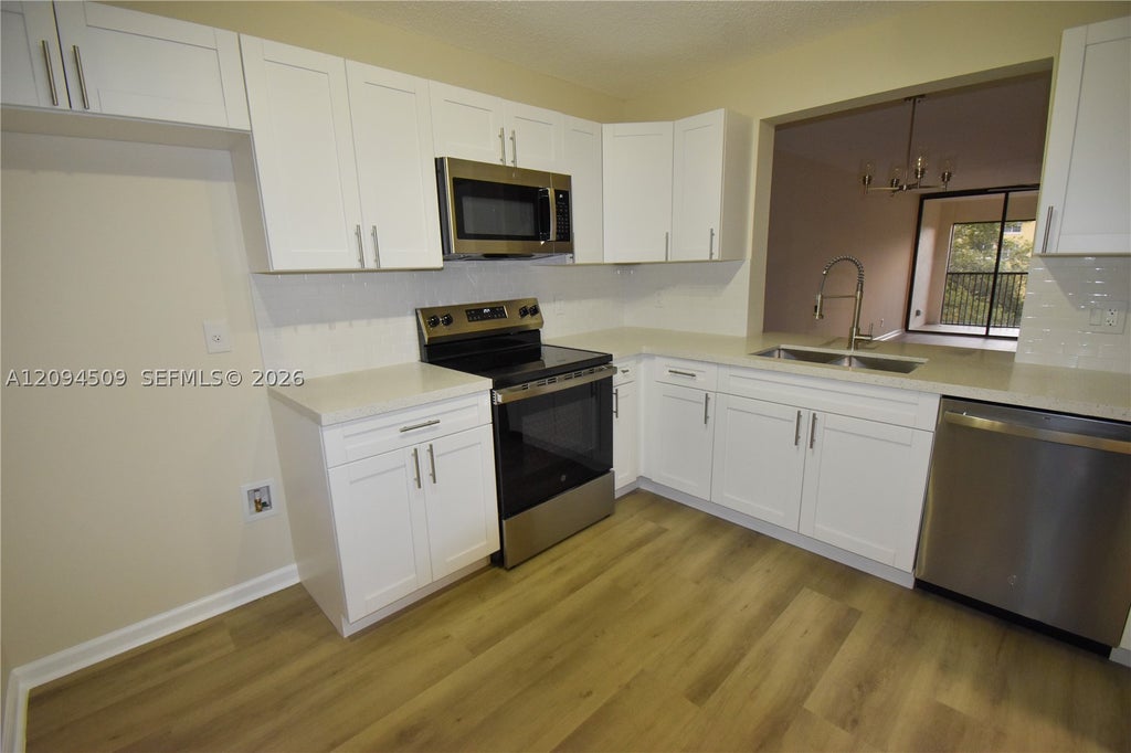 Photo of 8592 W Sunrise Blvd #303, Plantation, FL 33322 (MLS # A12094509)