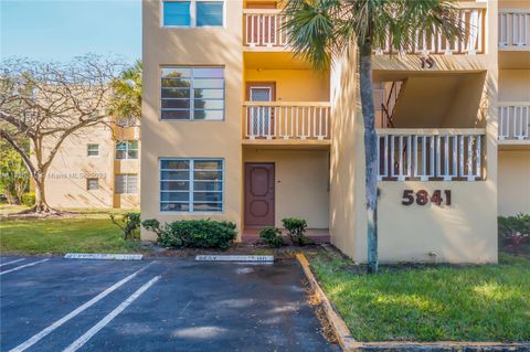 Photo of 5841 NW 61st Ave #101, Tamarac, FL 33319 (MLS # A11326310)