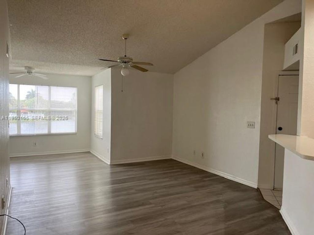 Photo of 12430 Vista Isles Dr #1322, Sunrise, FL 33325 (MLS # A11950165)