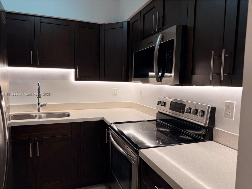 1-bedroom, 1-bath residence on the 4th (top) floor featuring tile floors, washer/dryer in-unit, central A/C, hurricane-impact windows, and a private balcony. The modern kitchen offers a refrigerator, electric range, and microwave. Perfectly located just 1.2 miles from Bal Harbour Shops, with restaurants, beauty salons, and top-rated schools within walking distance.
