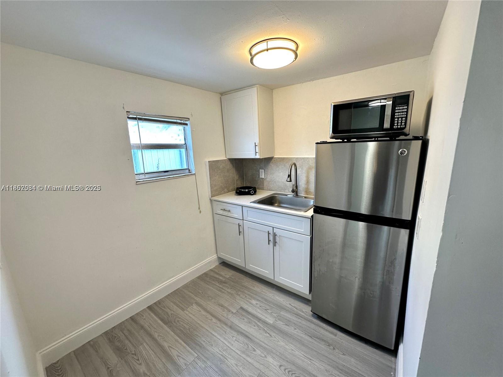 Spacious and privately accessed one bedroom, one bath unit, thoughtfully remodeled and move-in ready. Nestled in the heart of Miami just minutes from Miami International Airport, Coral Gables, Downtown, major highways, and the Beaches. Includes a refrigerator and microwave, with shared access to a coin laundry area. Rent includes water, electricity, internet, and one assigned parking space. For one occupant only. No pets permitted.