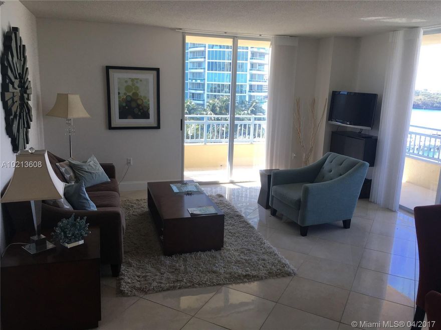 Most desirable line at The Yacht Club, corner unit, wrap around balcony facing the bay and beautifully furnished. Easy to show. Call LA.