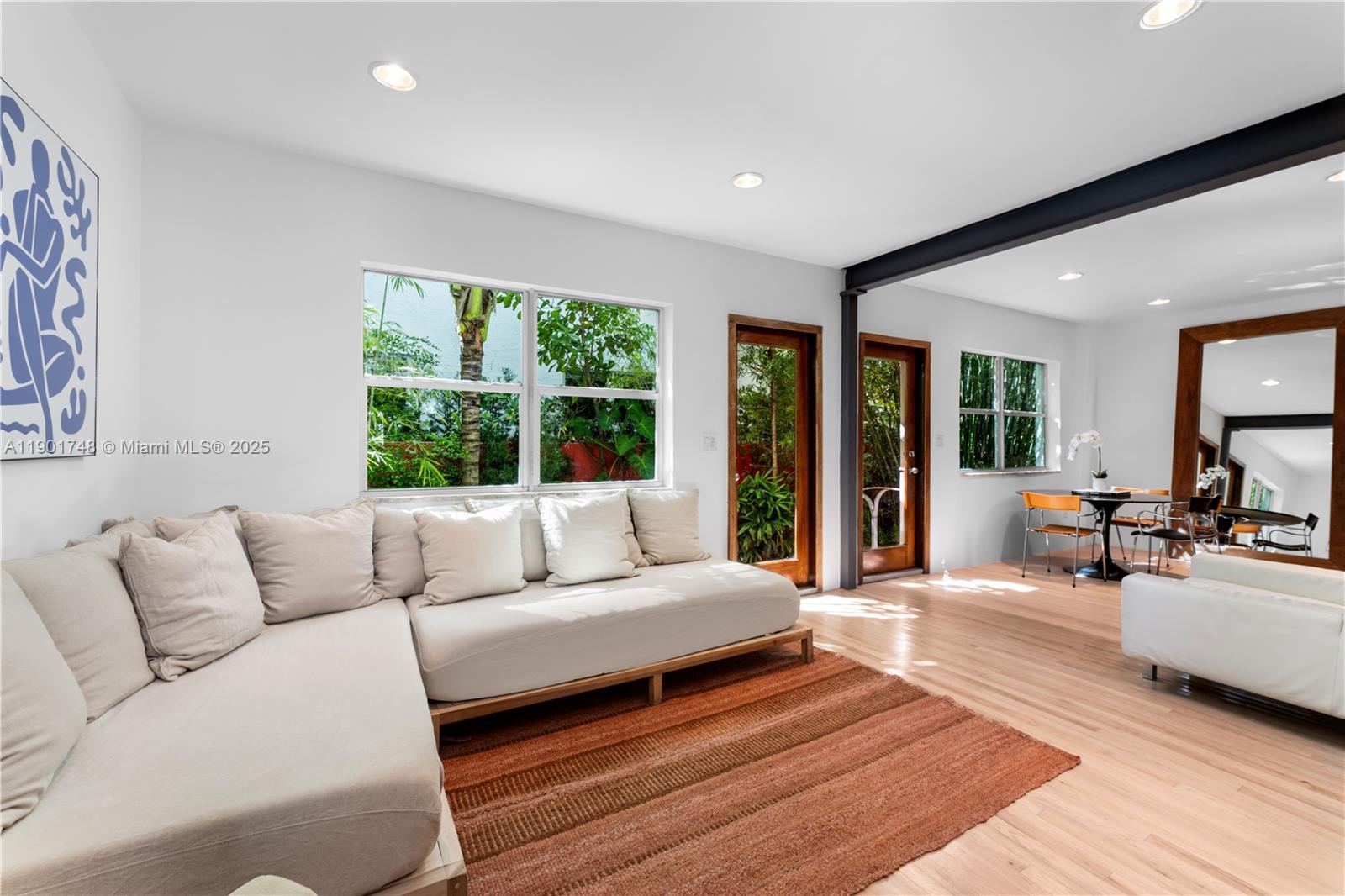 South of Fifth Beach Bungalow located on a premiere quiet block, nestled in a lush tropical botanical garden. This 1BD/2BA, 922 SF sanctuary blends natural textures with modern design. Warm white oak floors and Ipe wood walls create a serene, organic backdrop accented by Italian custom-built furniture and décor. The kitchen is a showpiece, featuring green marble counters, floating cabinetry, Blanco sinks, and a Fulgor Milano oven. The blue Spanish-tiled bathrooms with skylights evoke coastal Mediterranean charm, while the LG laundry area and Whirlpool dishwasher add everyday convenience. Experience true Miami Beach living in the heart of SoFi: a coveted area that is just steps to world-class dining and the beach.