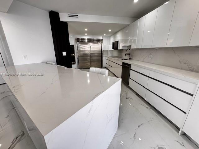 Completely newly remodeled RARE 2-story sky residence in the prestigious Williams Island. This 3 bedroom, 3.5 bathroom home offers 2,470 sq ft of modern living space with panoramic views of the Intracoastal, bay, and ocean. Features include private elevator entry, modern kitchen with quartz countertops, waterfall island, high-gloss white cabinetry, stainless steel appliances, and white marble flooring throughout. Spacious bedrooms with custom wall finishes, walk-in closets, and modern remodeled bathrooms with designer finishes. Multiple balconies on both levels provide stunning sunrise and sunset views. Williams Island offers world-class amenities including a full-service spa, fitness center, 16 tennis courts, restaurants, private marina, concierge, valet, and 24-hour security.