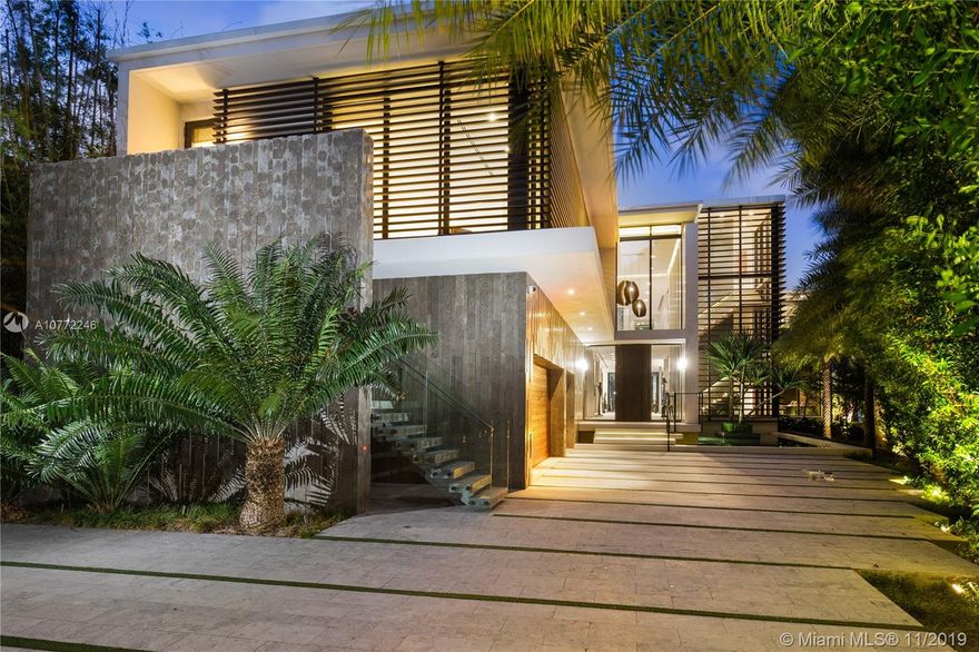 Contemporary home on gated Palm Island , wide breathtaking bay views. Step inside to immediate water views, select finishes, custom furniture & design accents throughout. Artistic wine cellar, dedicated theater, fully automated smart home. Custom Italian kitchen with concealing sliding glass.  Grand master suite offering amazing views, dual closets & dual showers. Office with private entrance. Open floor plan, floor to ceiling rear sliding glass doors,  Panoramic, 110ft  waterfront w large dock, infinity-edge pool & spa.  Aquablue Design  detail, & quality finishes. Architectural concepts by Borges & Associates.