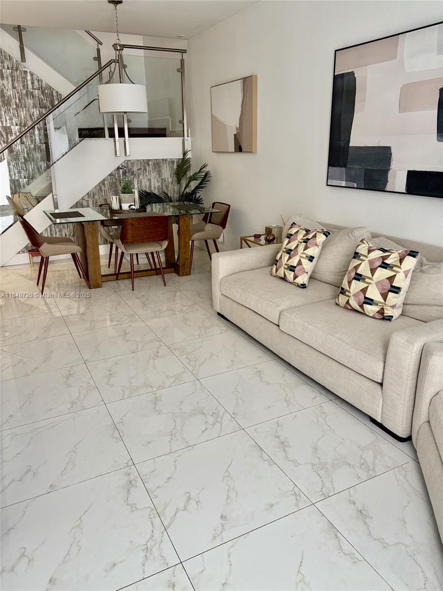 Make this your home, NEOVITA, a modern community in Doral, this 4 bedrooms and 3 full bath townhouse, one convenient bedroom with a full bathroom on the first floor. Kitchen Island, top of the line stainless steel appliances. 1 car garage, 2 cars driveway, and guest parking available. high impact windows, tile and laminated good quality wood floors . Nice patio with no neighbors on the back. Close to shopping malls, and Top-rated schools. Easy access to major highways such as Turnpike and 836. Gated Community with a modern clubhouse, swimming pool, multipurpose room, Gym, and playground.