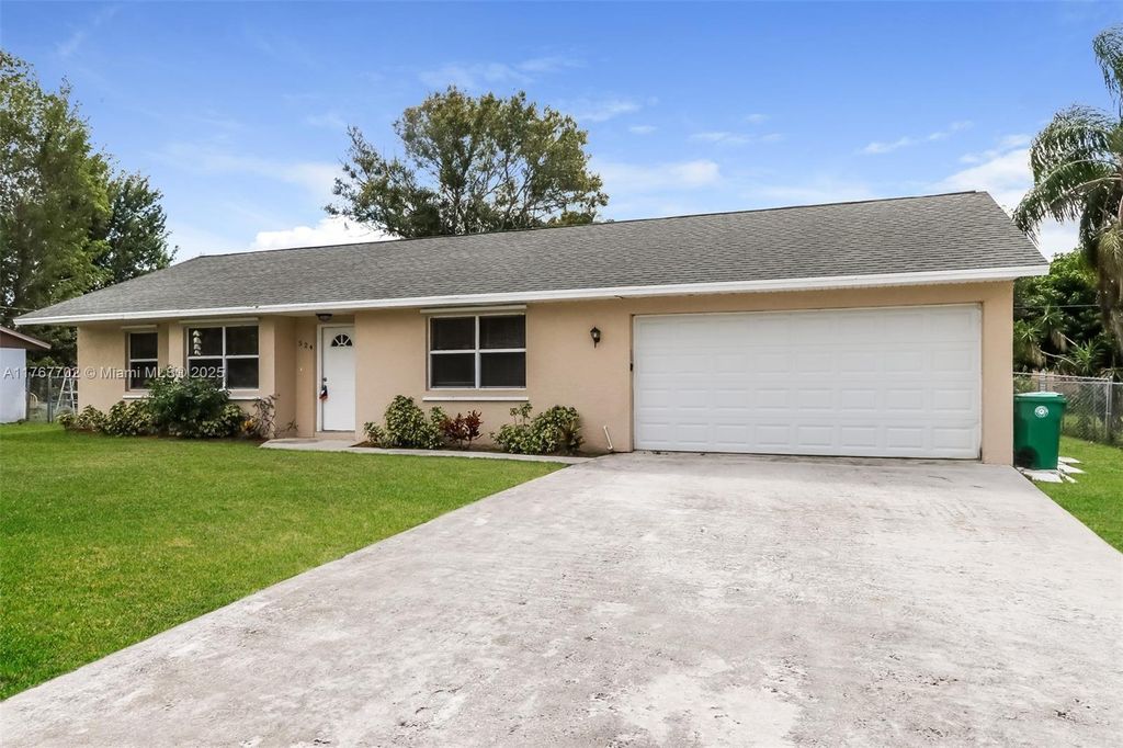 Photo of 524 SW Buswell Ave, Port Saint Lucie, FL 34983 (MLS # A11767702)