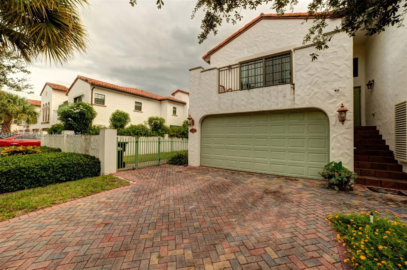 Set in the gated enclave of The Oaks at Hidden Harbour, this spacious townhome offers 3 upstairs bedrooms including a large primary suite with a private balcony. The first floor features a flowing layout with a generous living/dining area, powder room, and eat-in kitchen. Enjoy the convenience of a 2-car garage and a deeded dock accommodating up to a 35' boat with direct Intracoastal access. Community amenities include a resort-style pool, fitness center, and just 39 Mediterranean-style residences for added exclusivity.