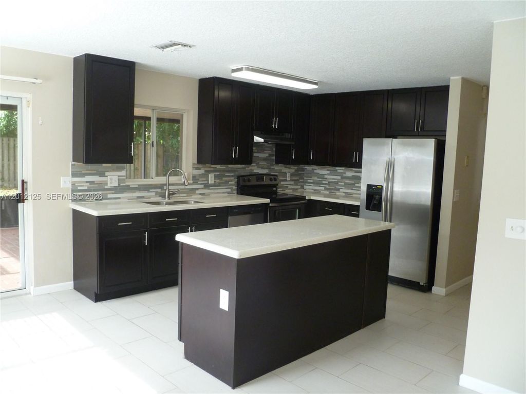 Photo of 8820 SW 13th St, Pembroke Pines, FL 33025 (MLS # A12012125)