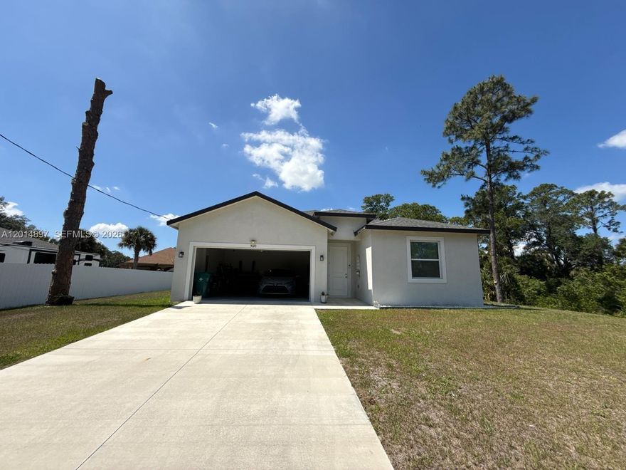 BUYER INCENTIVES AVAILABLE! Welcome to this house built single-family home in the heart of Labelle, offering modern comfort with a touch of Southern charm. This beautiful residence features 3 bedrooms, 2 bathrooms, and approximately 2060sq ft of living space with an open-concept layout. Enjoy a stunning kitchen with quartz countertops, stainless steel appliances, and a peninsula island. The primary suite includes a walk-in closet and elegant en-suite bath with dual sinks and walk-in shower. Energy-efficient windows, 2 car garage with a bay for an additional 4 cars., and private backyard. Conveniently located near schools, dining, and recreation. Seller offering $10,000 in incentives!