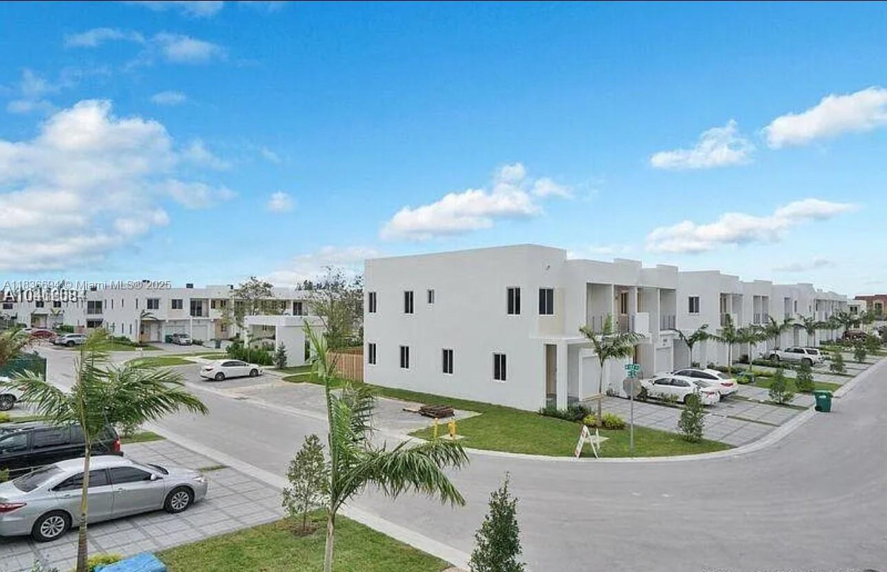 Corner Townhouse in luxury community in Doral--NEOVITA. Residence with open layout and high ceiling, 4 Bedroom, 3.5 Bathrooms and top-of-the line appliances, granite counters. Washer & Dryer. Gated Community, great location and neighborhood close to shopping centers, restaurants, etc. A+ schools.
