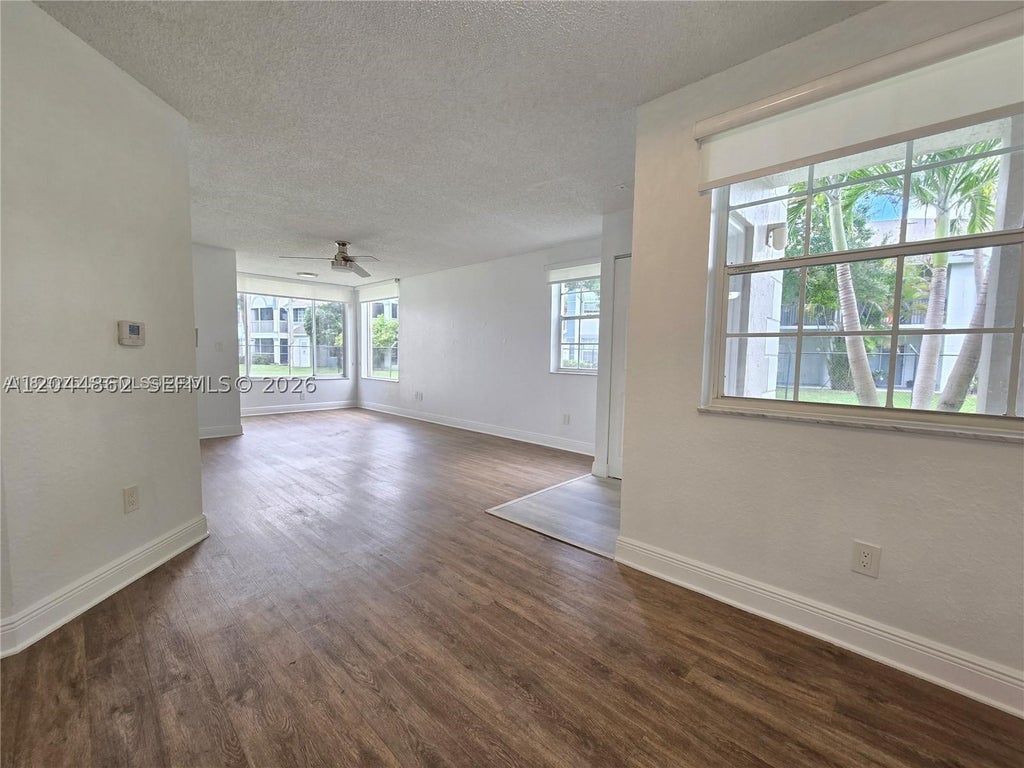 Photo of 2890 N Oakland Forest Dr #102, Oakland Park, FL 33309 (MLS # A12044862)